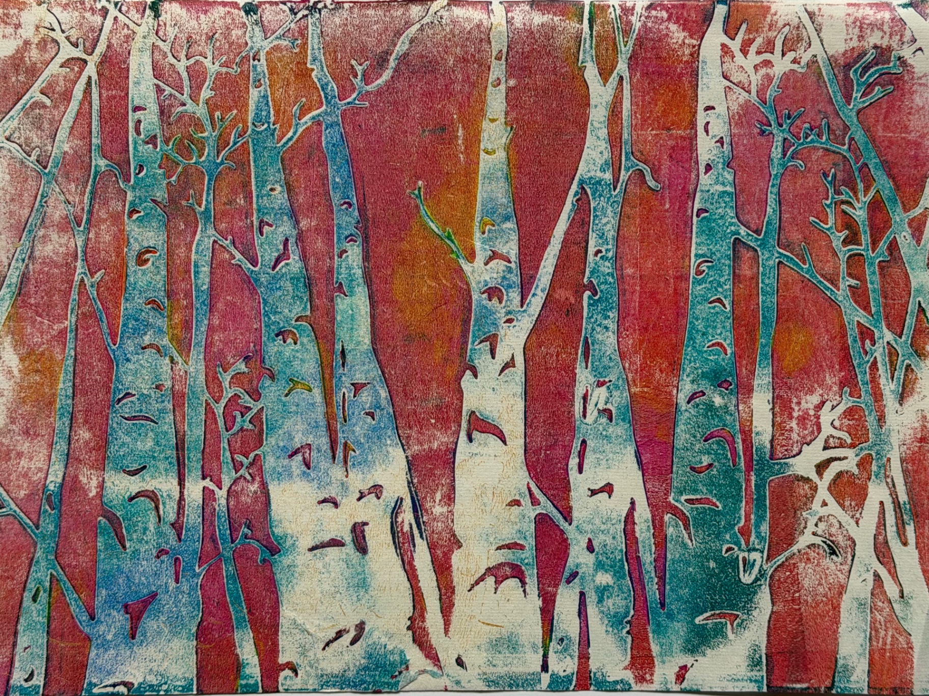 Colourful monoprint of birch tree trunks in red, blue and white