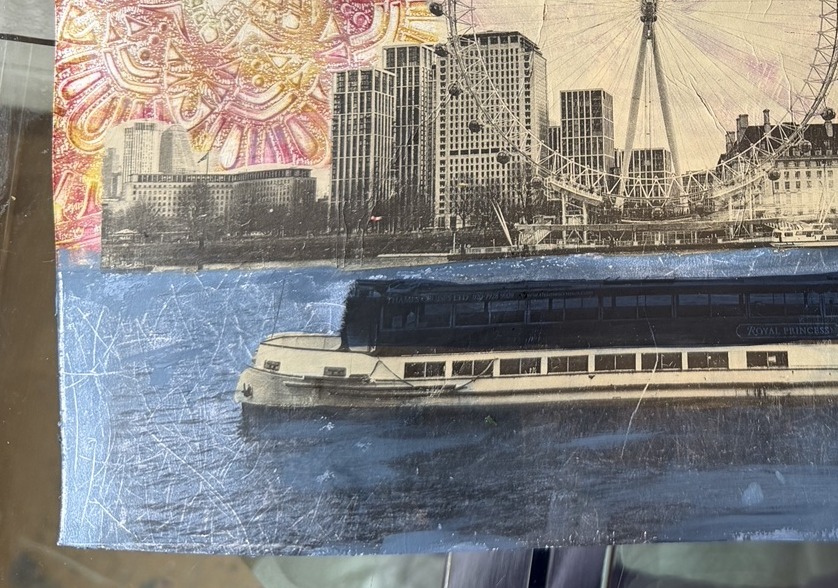 Monoprint of the London Eye and skyline half on slate blue, half on hot pink and yellow mandala print